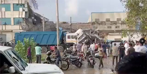 Indian rescuers pull eight dead from collapsed building