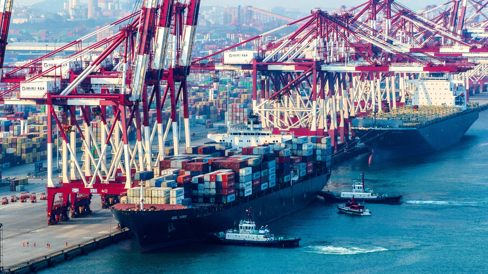 Chinese exports top forecasts but imports slow sharply