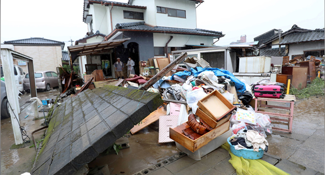 Japan orders evacuations as heavy rains trigger floods in quake-hit region