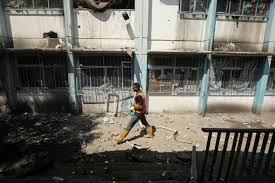 Gaza rescuers say Israeli strike on school-turned-shelter kills 21