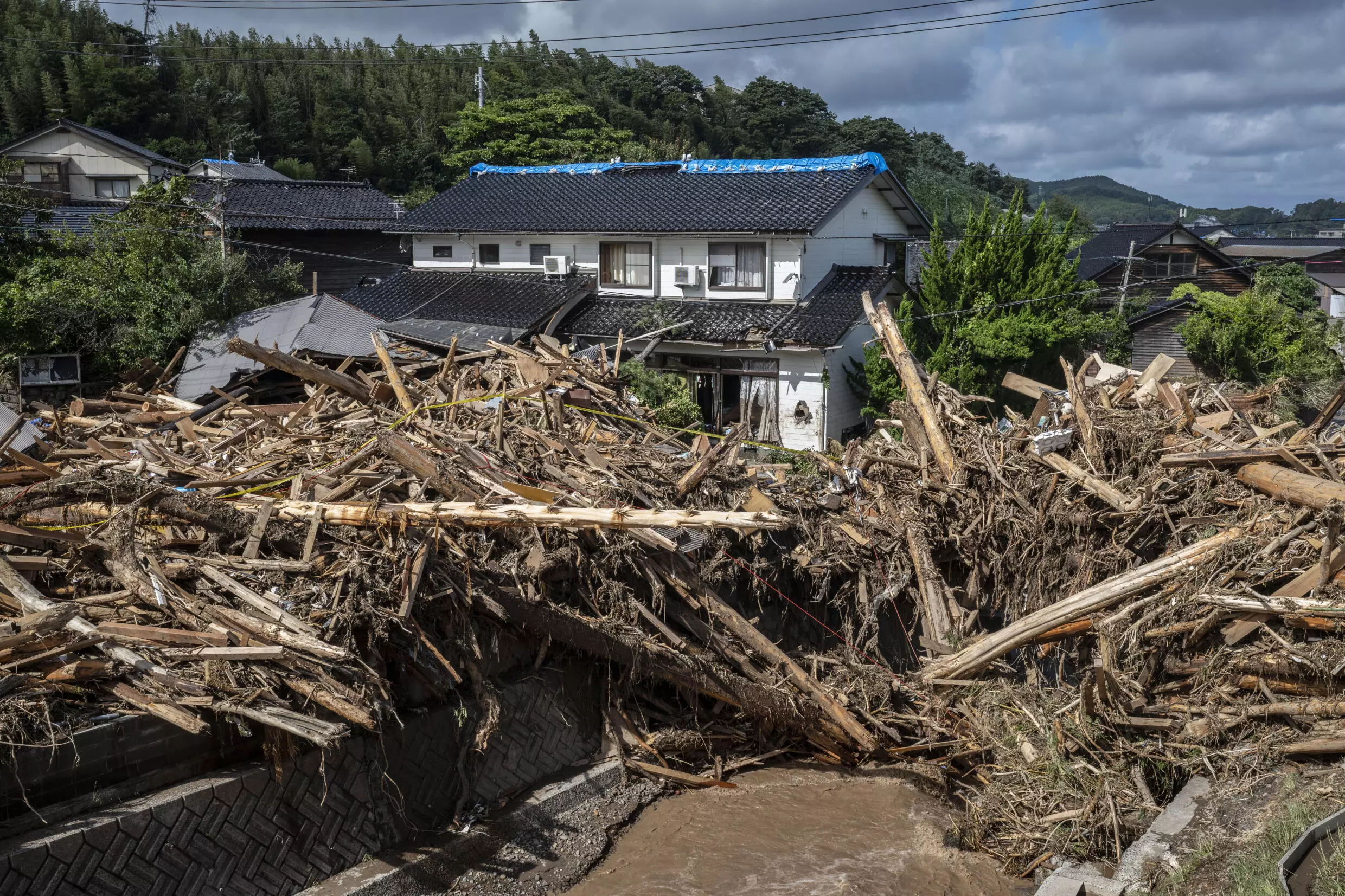 Japan quake, flood victim attemps fresh start with wife's memory