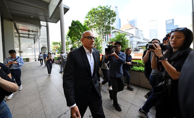 Rare corruption trial of Singapore ex-minister begins