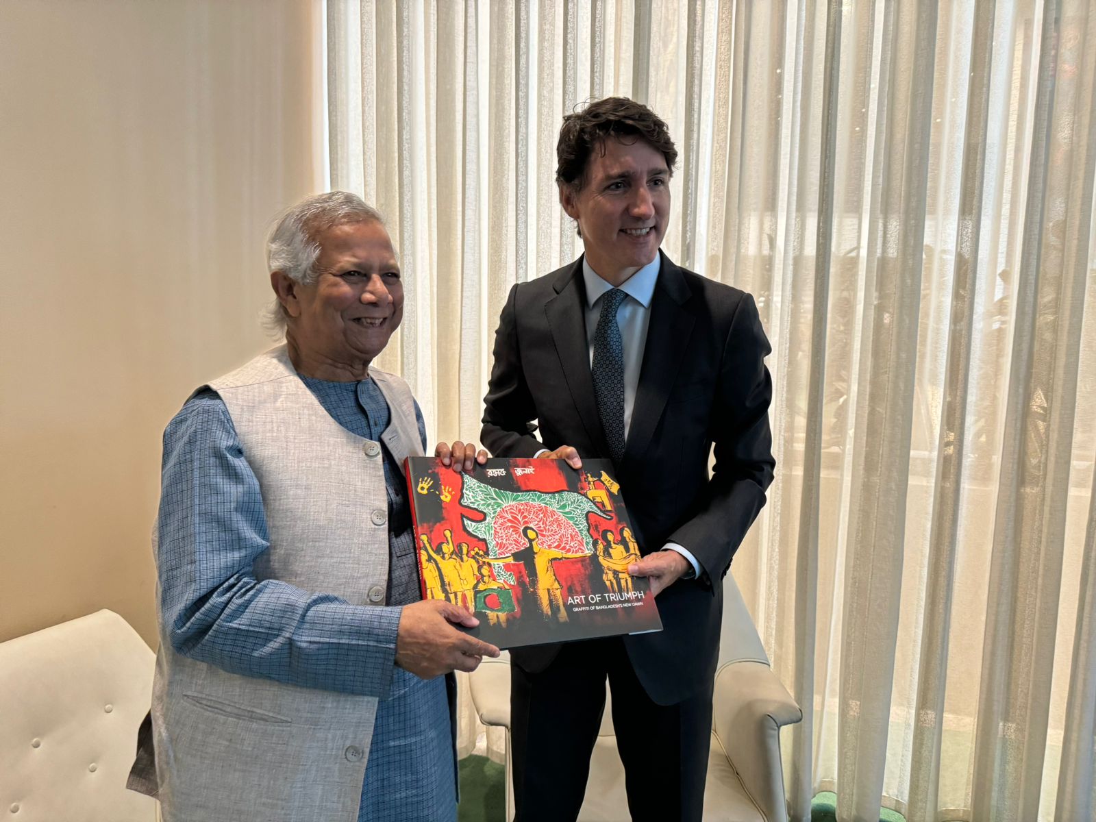 Prof Yunus hands over ‘The Art of Triumph' to Justin Trudeau