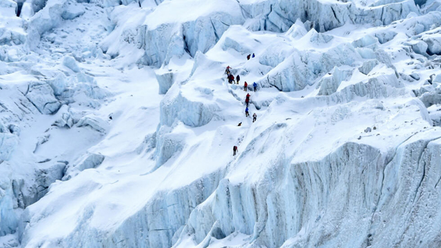 Record number of climbers chase 14-peak dream in Tibet