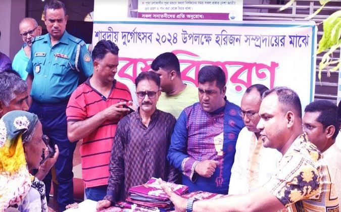 Rangpur Harijan people get clothes as Durga puja gifts