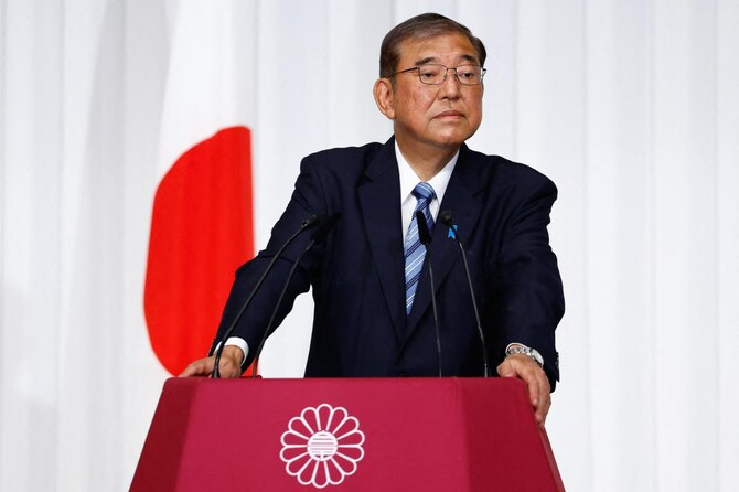 Japan PM vows to stay on despite election debacle