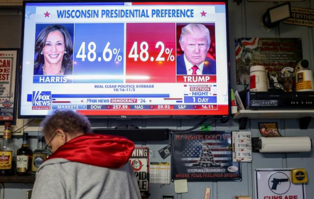 Asian markets swing ahead of toss-up US election