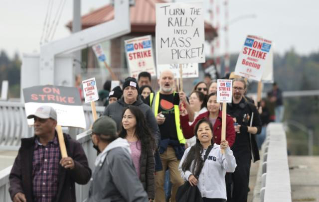 Striking workers weigh latest Boeing contract offer