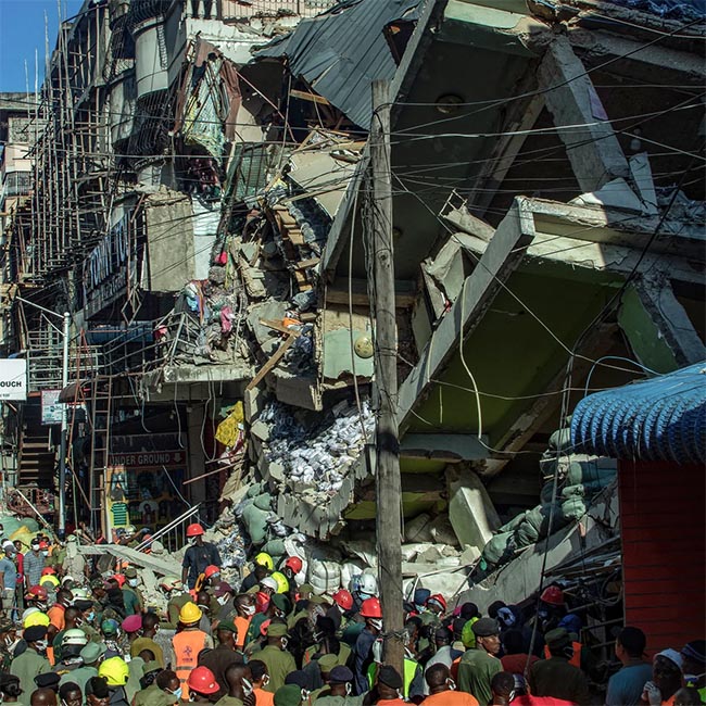 Rescuers race to reach people still trapped in collapsed Tanzania building