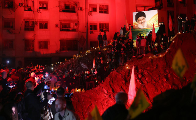 Hundreds gather at site of air strike to remember Hezbollah chief