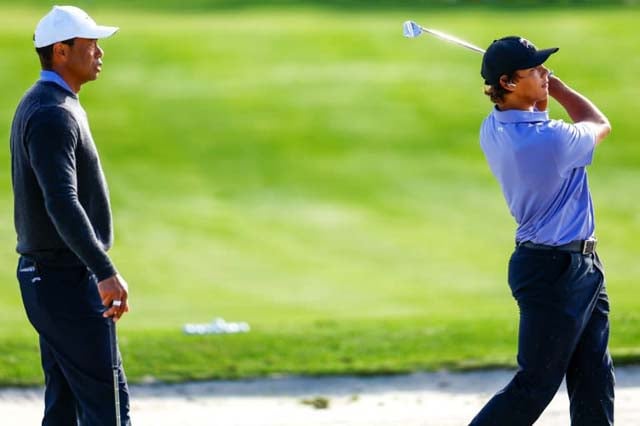 Tiger in family golf event but has 'long way' before PGA return