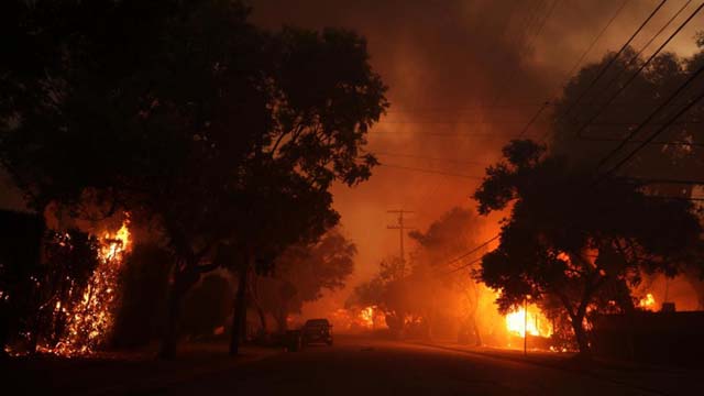 Wildfire sparks panicked evacuations in Los Angeles suburb