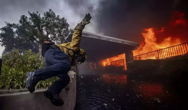 Los Angeles investigates fire blame as curfew enforced