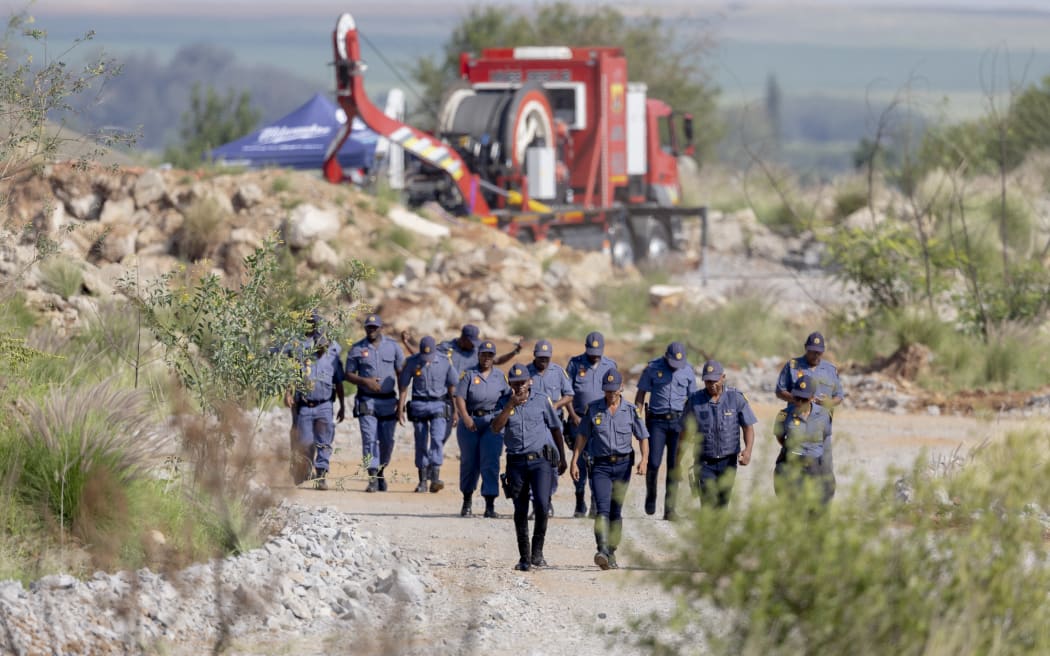 Dozens rescued, bodies pulled from S. Africa mining pit