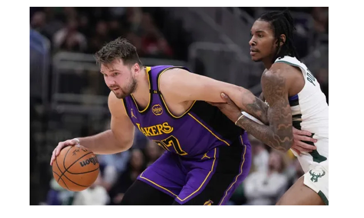 Doncic leads Lakers romp over Nuggets, Kings upset Cavs